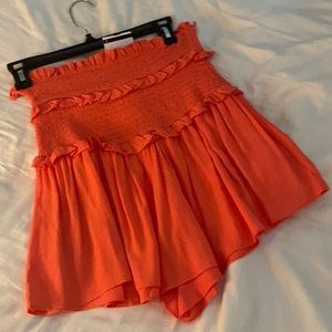Smocked orange flowy shorts
